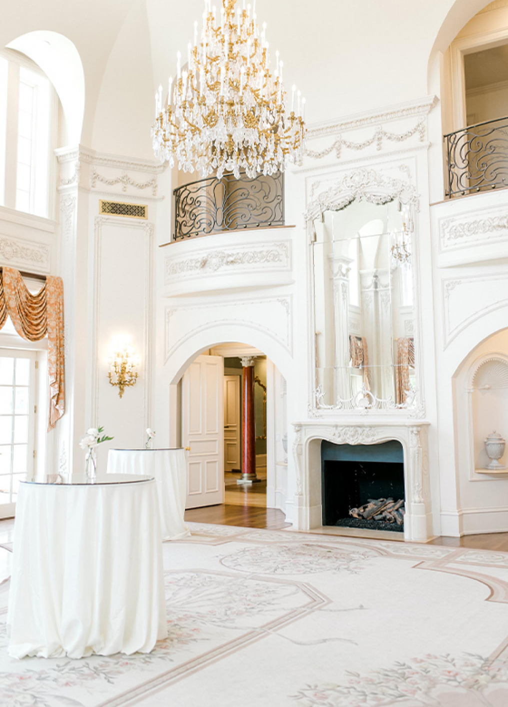 Bright chandelier room inside The Olana