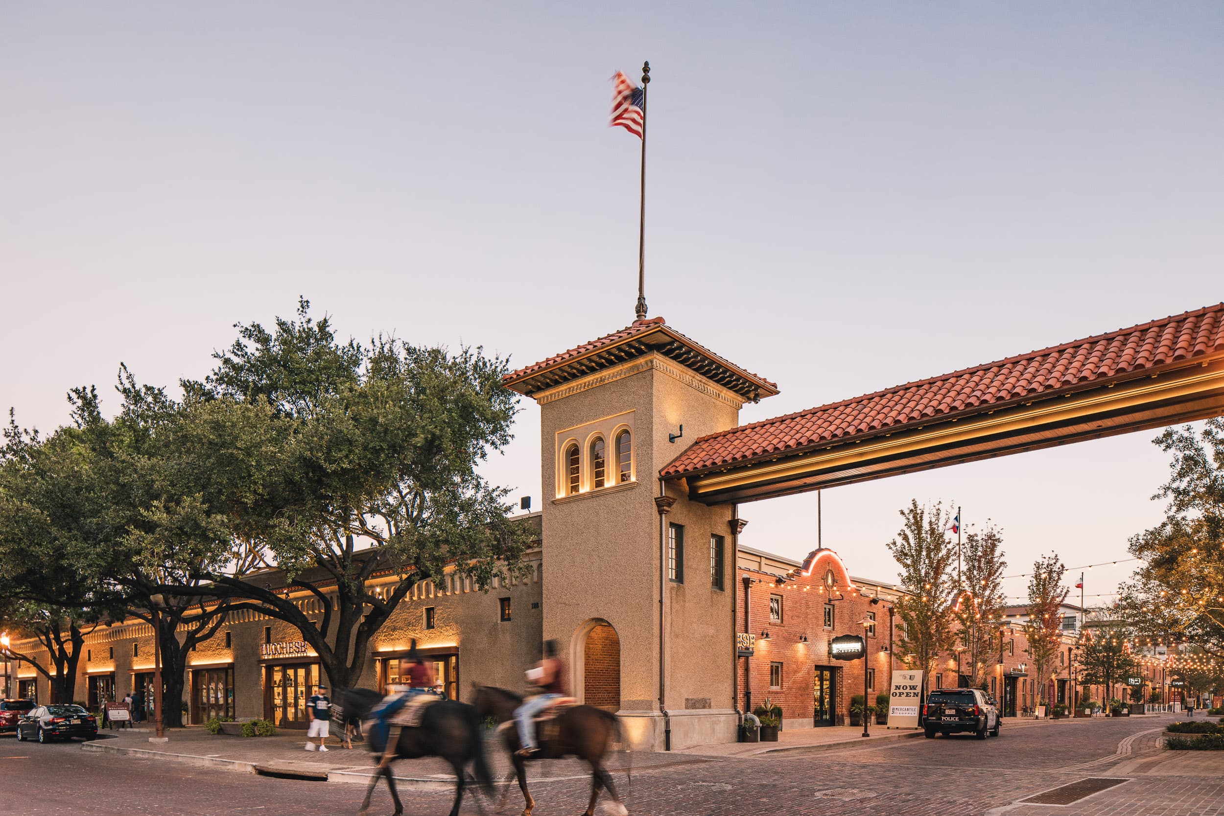 Stockyards entrance arch and historic buildings at dusk