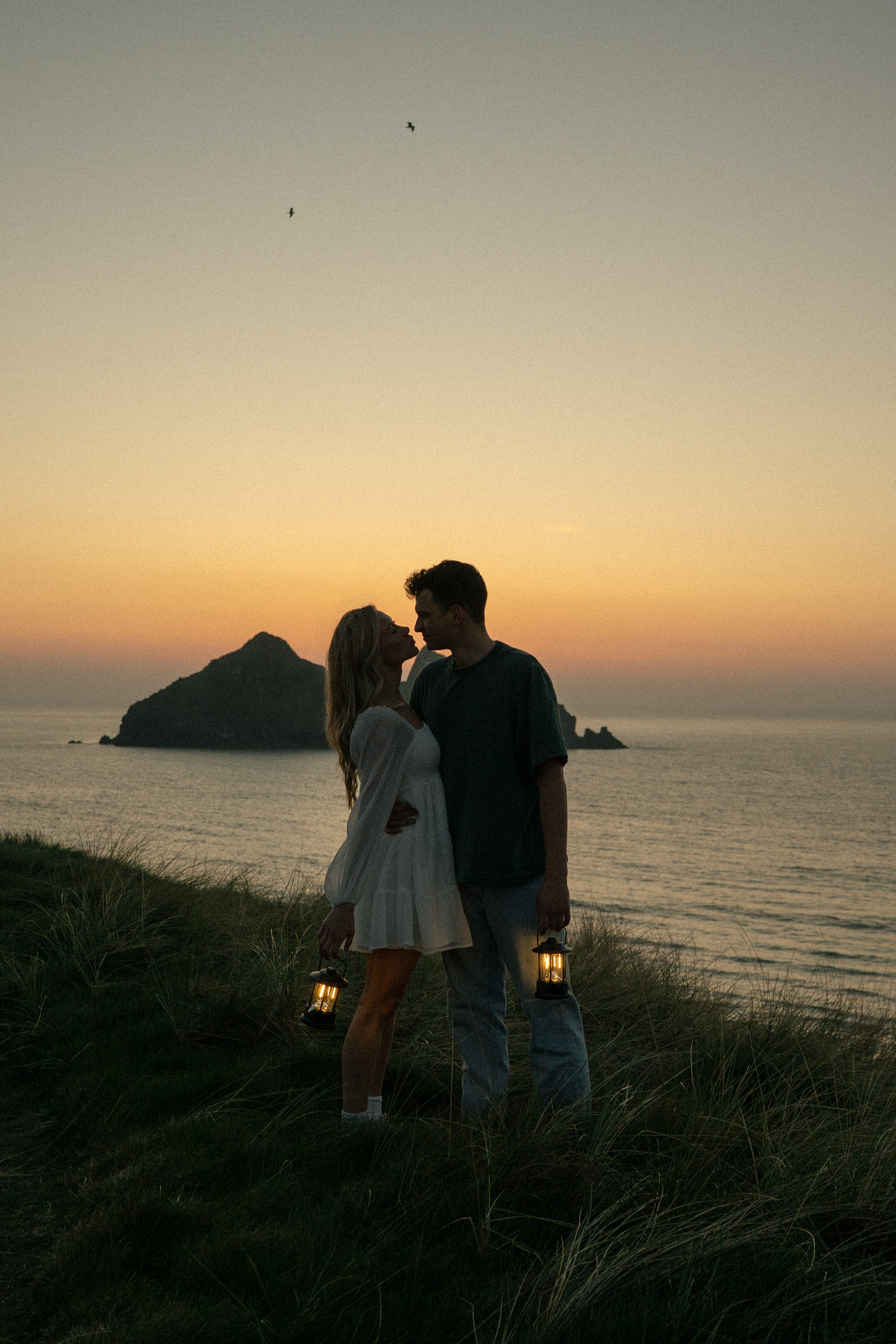 Reuben and Vanessa leaning together at sunset